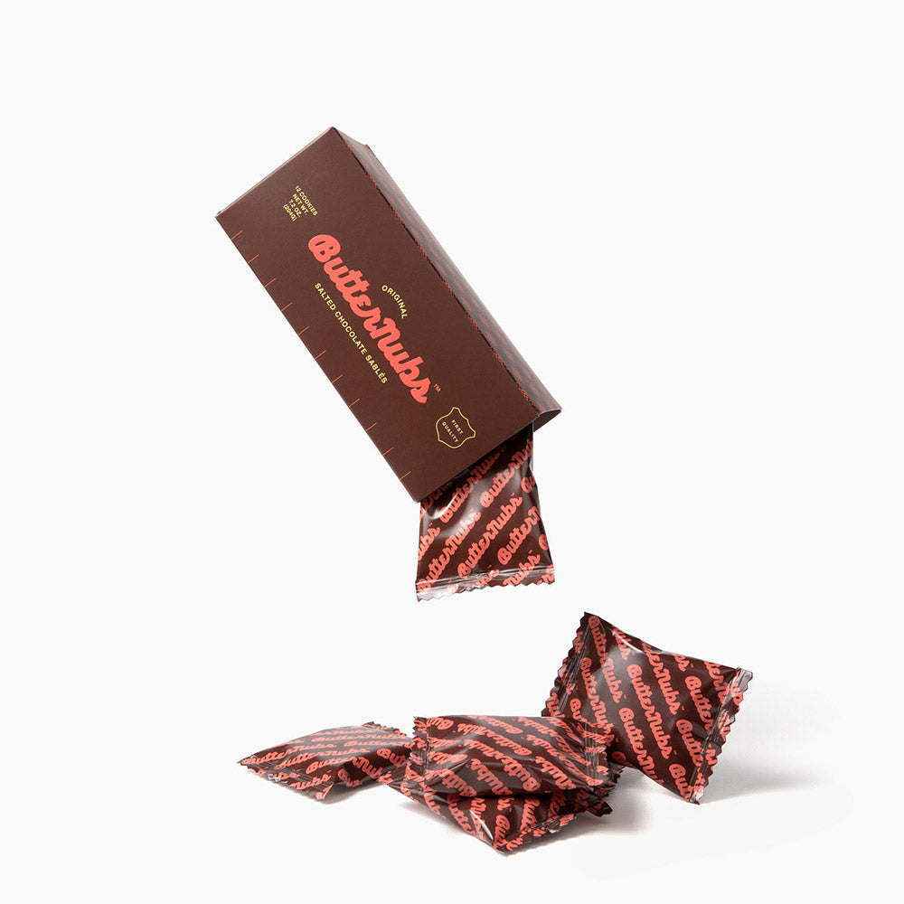 Chocolate Butternubs contains 12 individually wrapped salted sablé shortbread cookies in a box